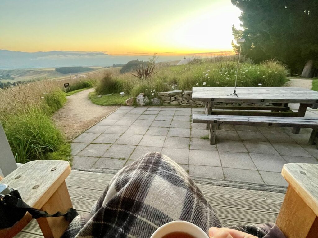 Reduce screen time while travelling by sitting down to watch the sunrise with a cup of tea and not digital elements