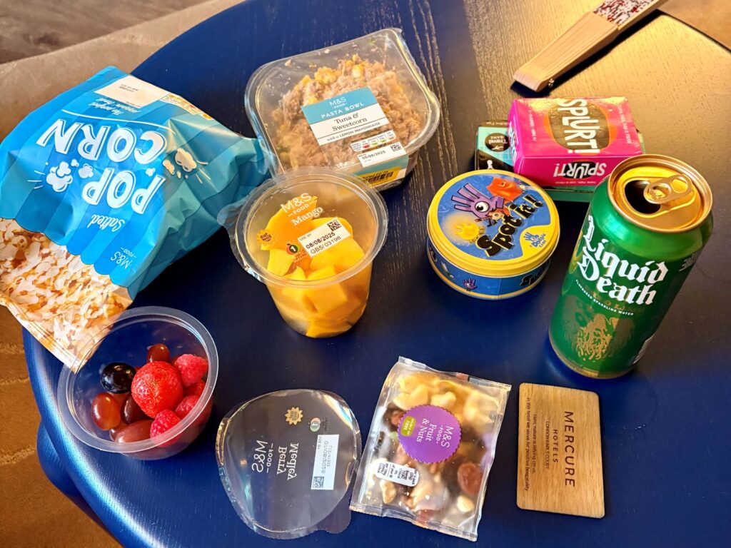 Selection of healthy travel snacks and ultra-processed foods set out during a hotel stay