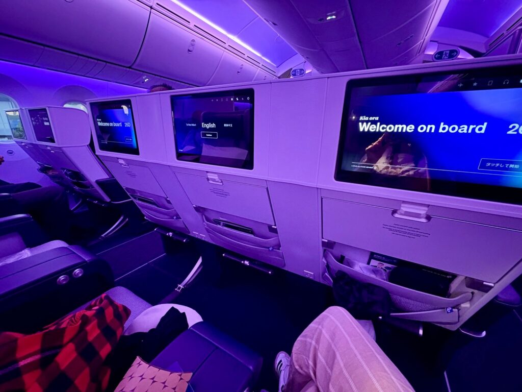 Long-haul flight premium economy empty seats during boarding