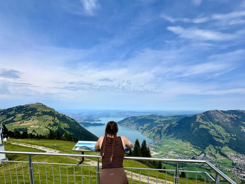 Girl looks out at scenic view in Switzerland practicing mindful travel