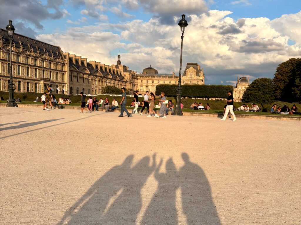Group of people travelling together, photo taken of their shadows together