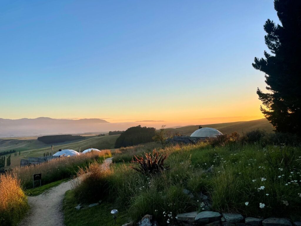 Morning sunrise over a glamping site in New Zealand