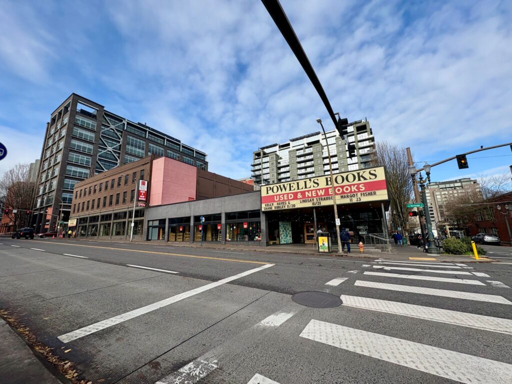 Downtown Portland showing a road crossing and Powells Bookstore in the distance