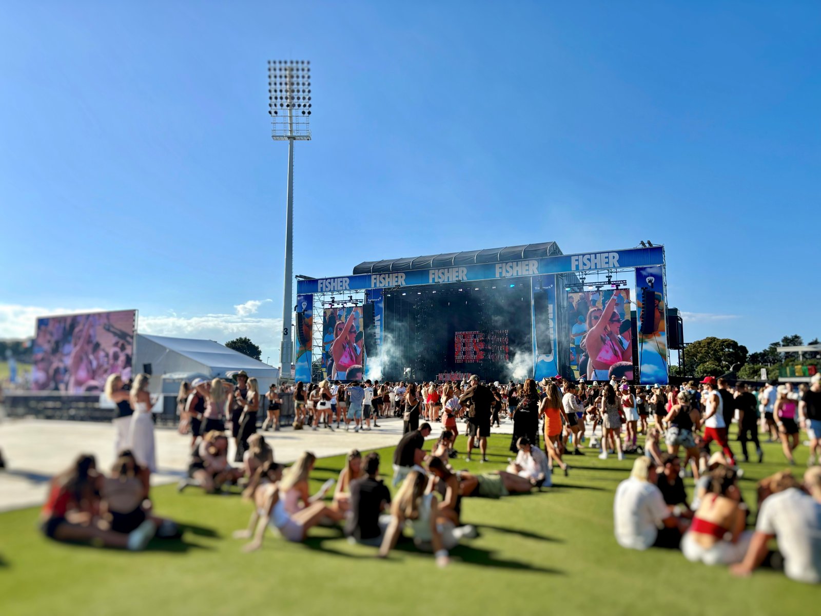 Overlooking a crowd at a festival from a distance from the mainstage