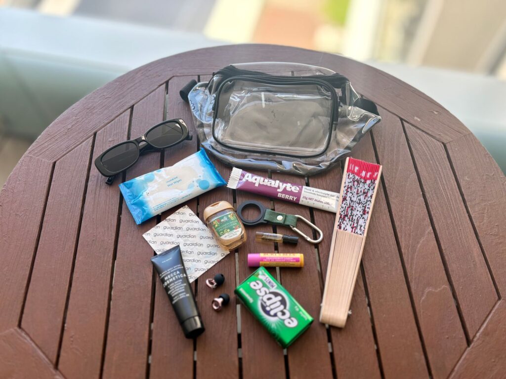 A selection of items laid out on a table to help festival financial anxiety by being prepared with what you take