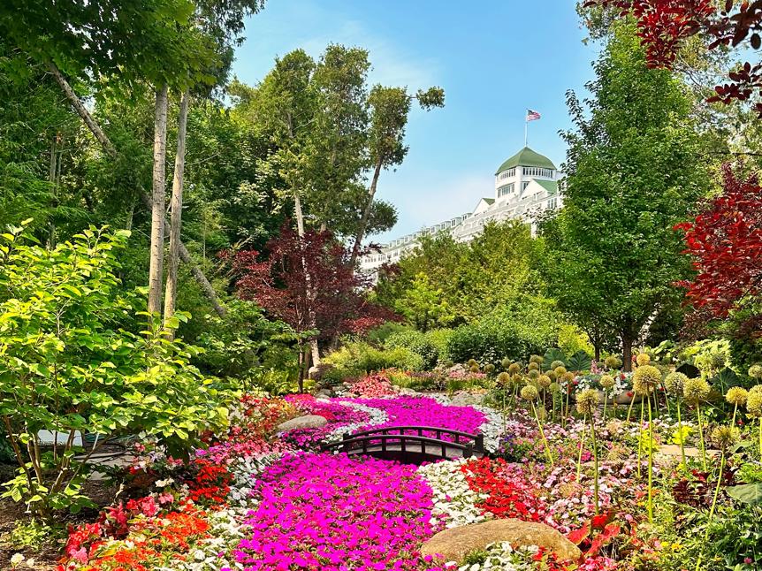 The Grand Hotel Mackinac Island secret garden in summer, flowers in full bloom