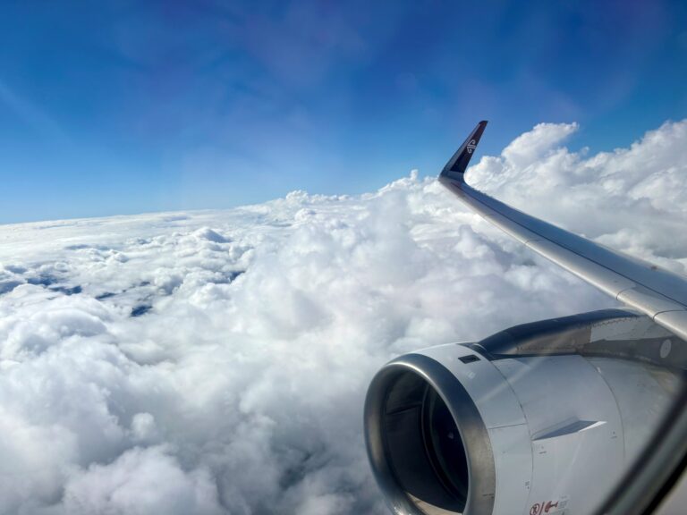 View out of plane window looking at clouds