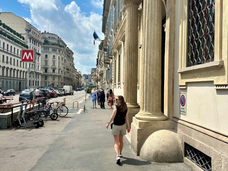 Woman walking while travelling through Milan streets