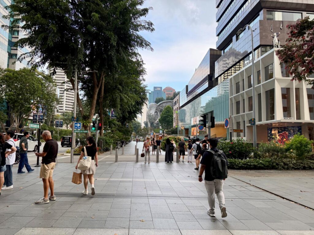 People walk through a street in Sinagpore, showing how easy it is to walk in the city