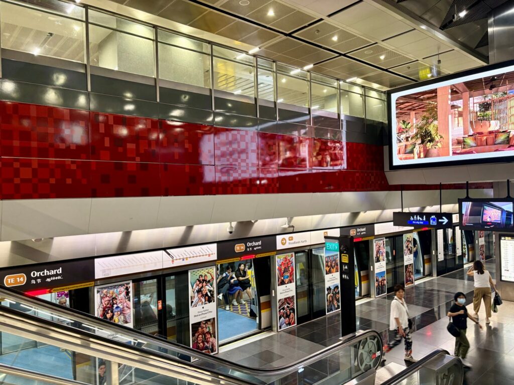 Using the MRT in Singapore - people at a station
