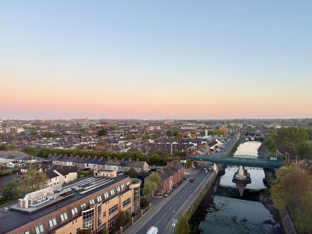A sunrise over Dublin city, showing natural ways to recover from jet lag with morning light exposure