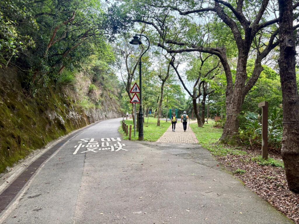 Two people hiking in Hong Kong on the Lung Fu Shan Morning Trail