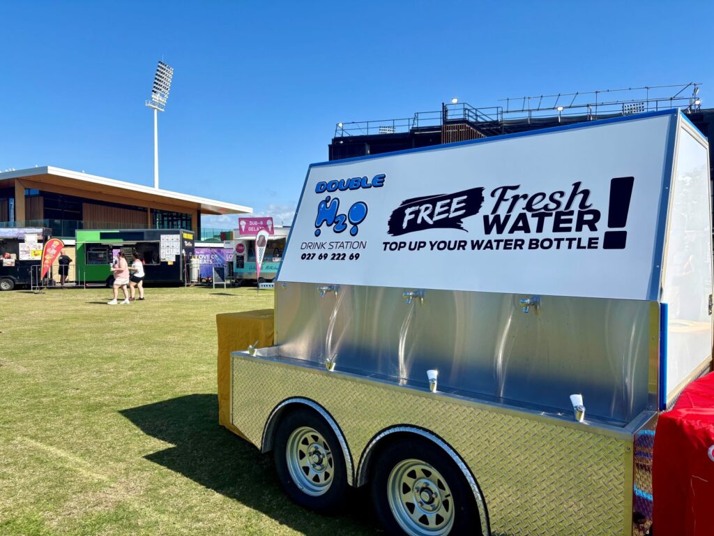 A water station with free refills at a festival, great for taking an empty bottle which is on your festival wellbeing packing list