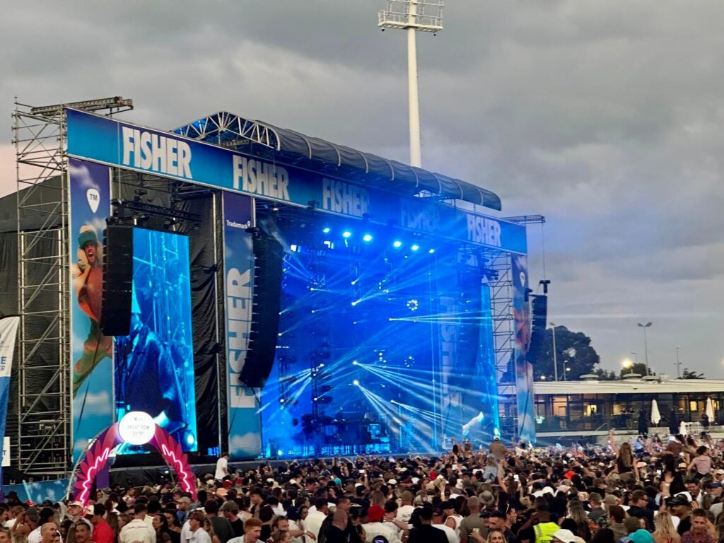 Enjoying a festival at the back of a crowd