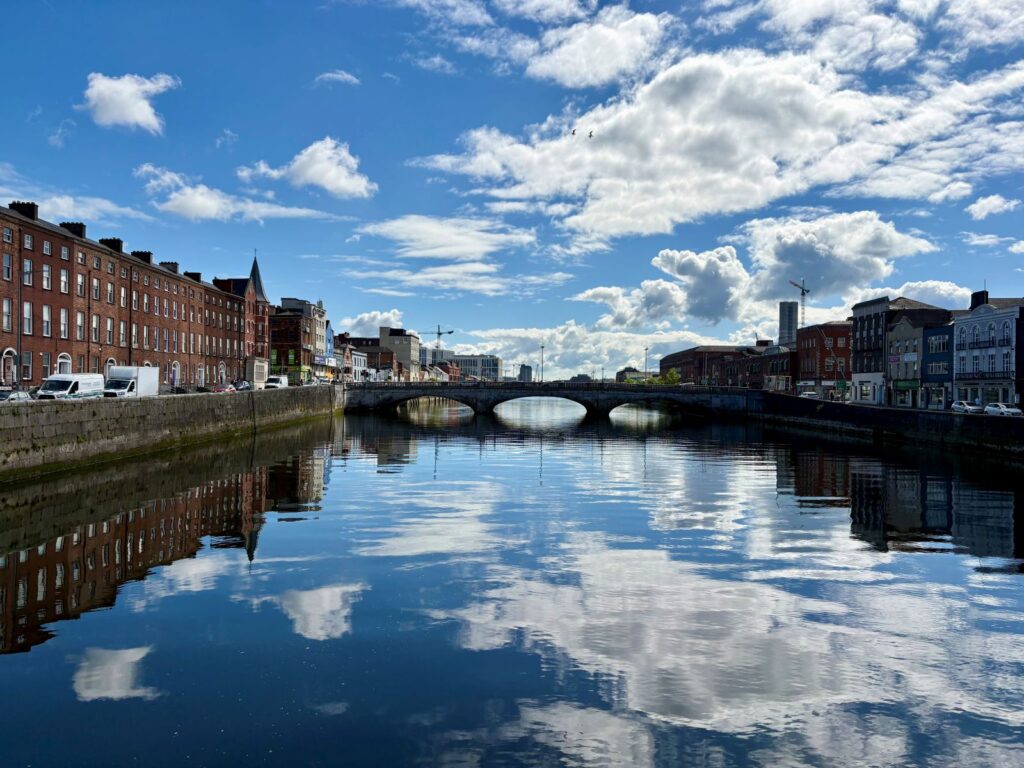 Reflective clouds in the water taken from a bridge in Cork during an Ireland road trip
