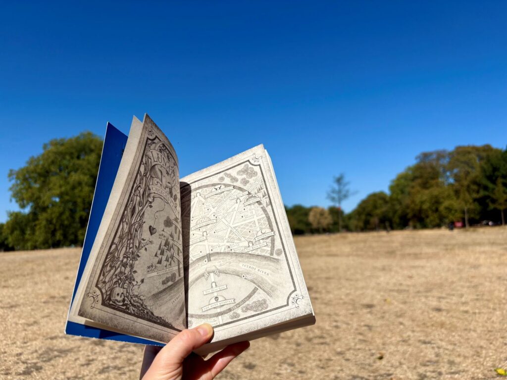 Reading fantasy books on holiday in a park in London