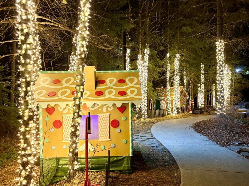 Walking through a pathways of Christmas lights at a hotel in Canada while travelling at Christmas